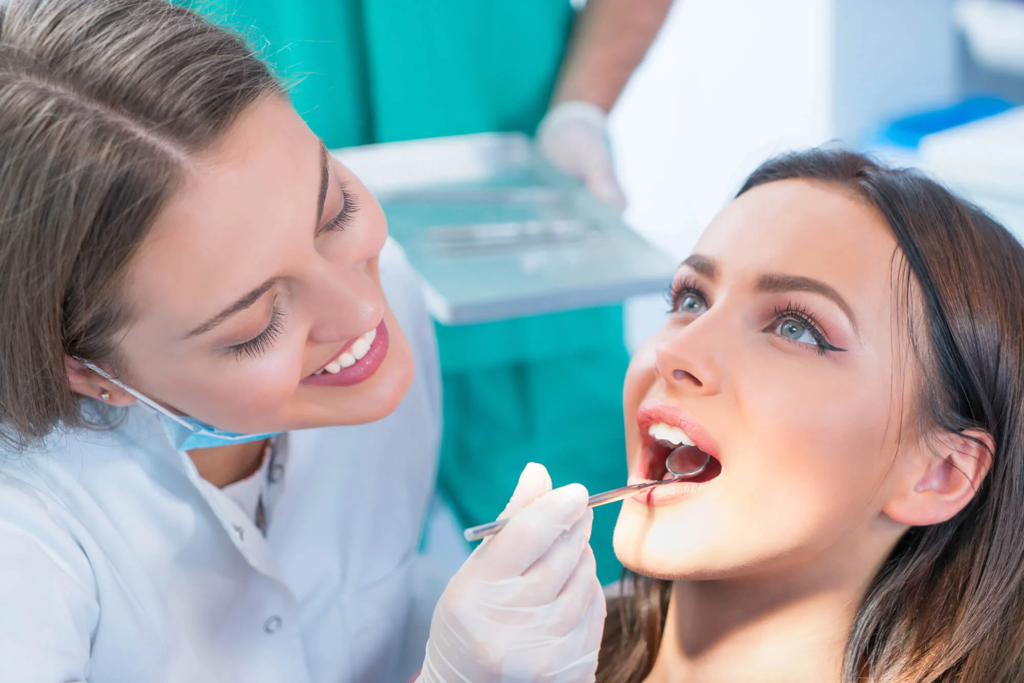 Dentist In Canton, Mi Discussing Treatment With Patient.