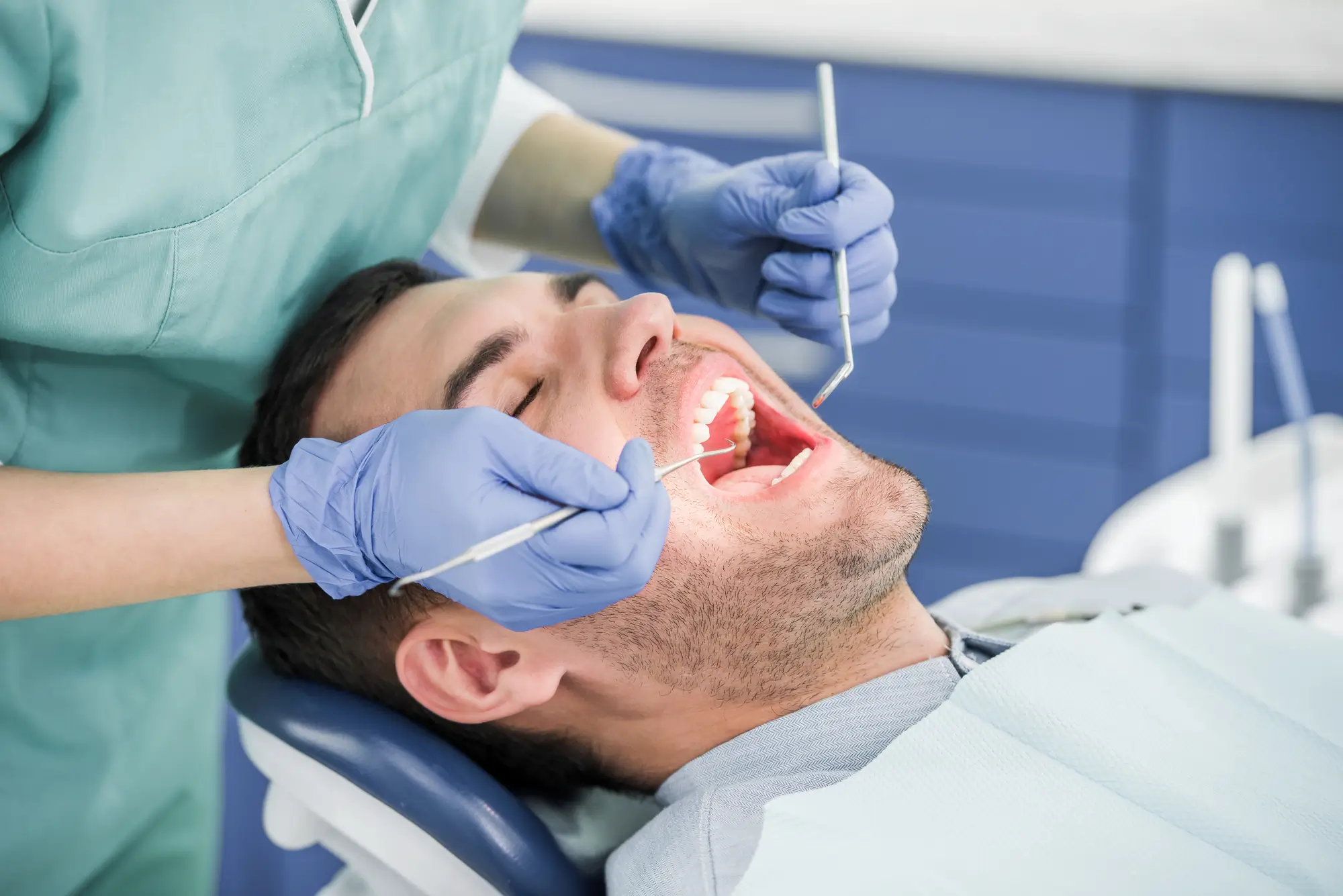 Dental Financing Canton Michigan Dentist Examining Patient Mouth