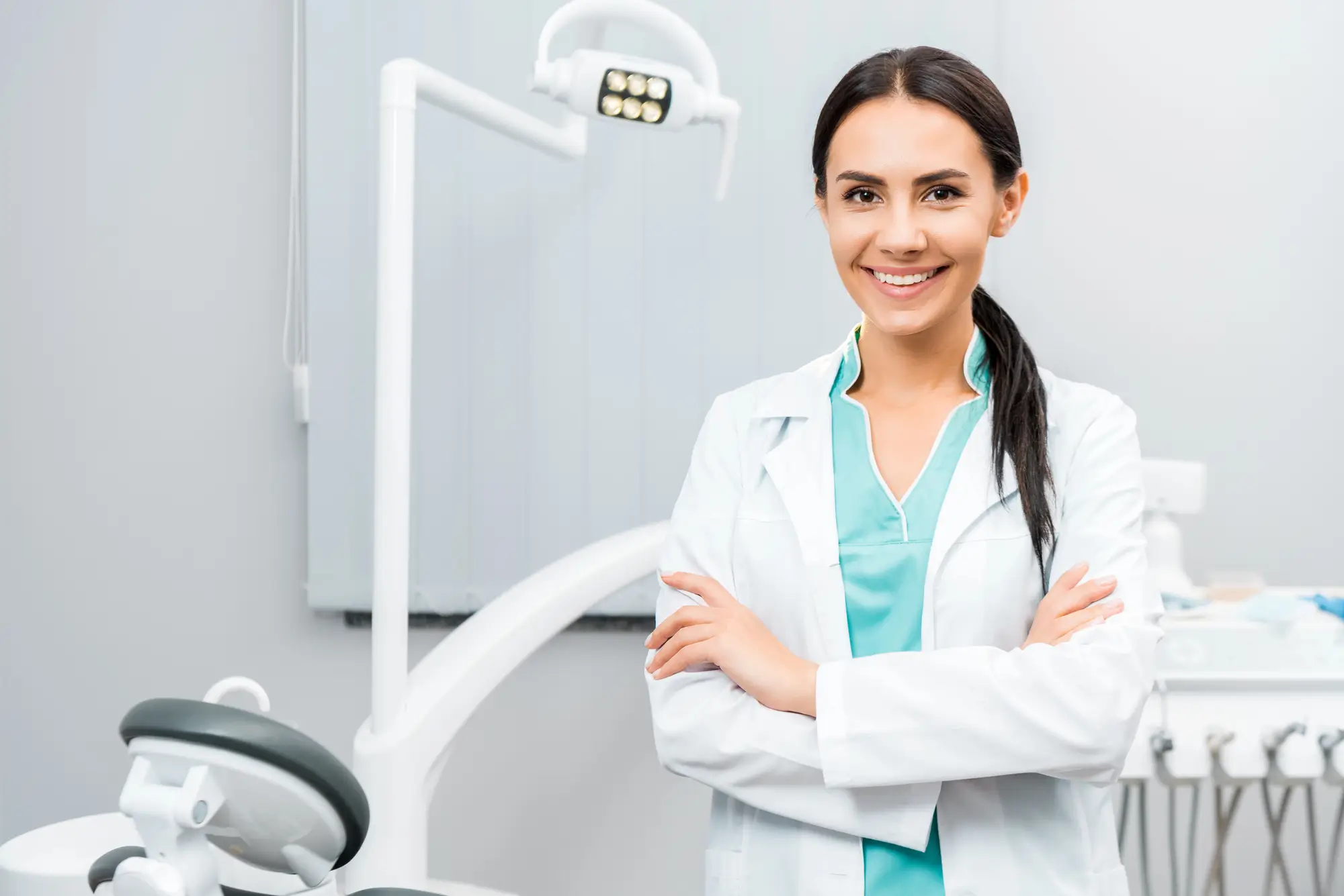 Dental Financing Canton Michigan Dentist Standing With Crossed Arms