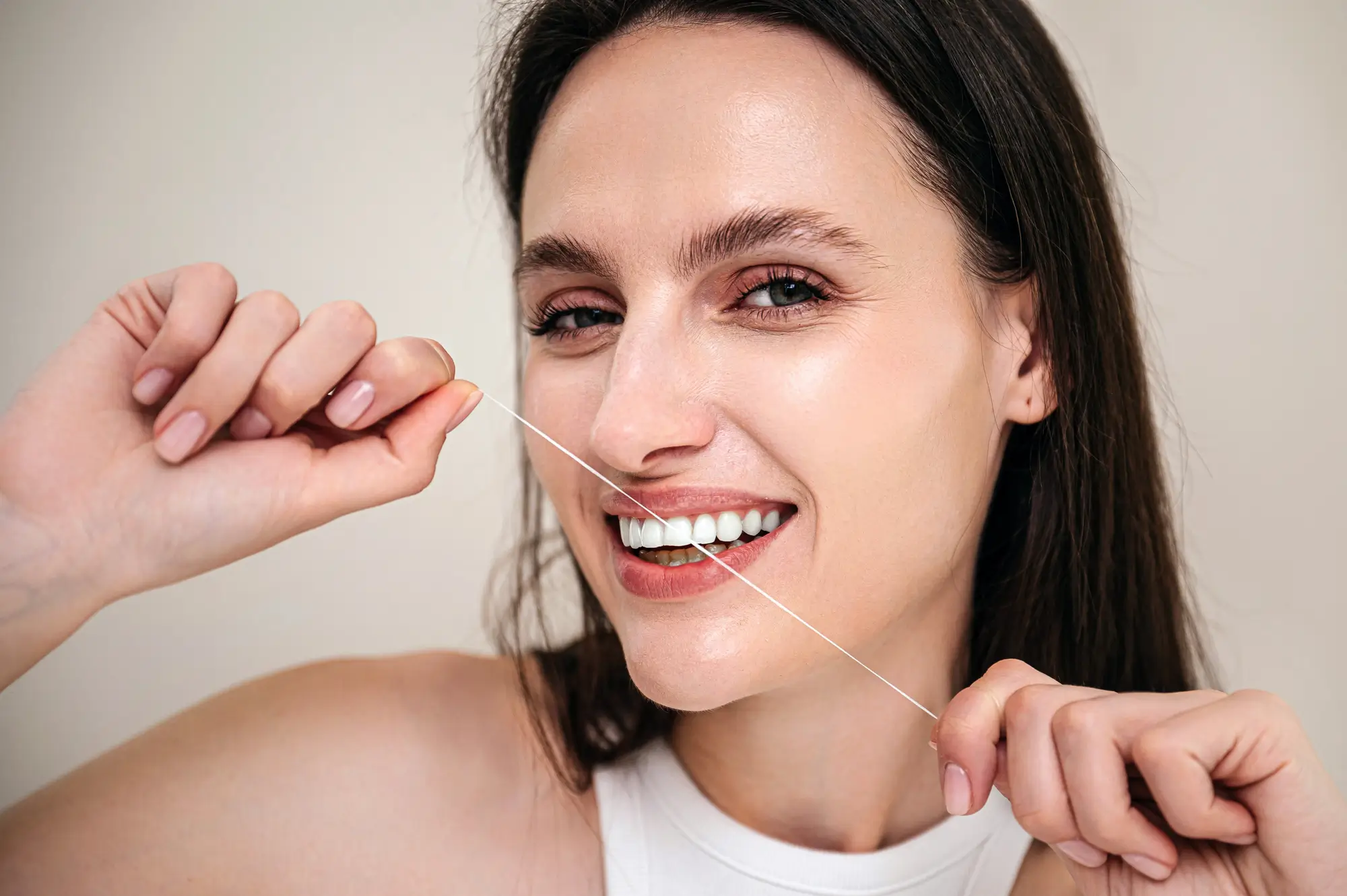 Smiling Woman Brushing Teeth After Gum Disease Treatment Canton Care