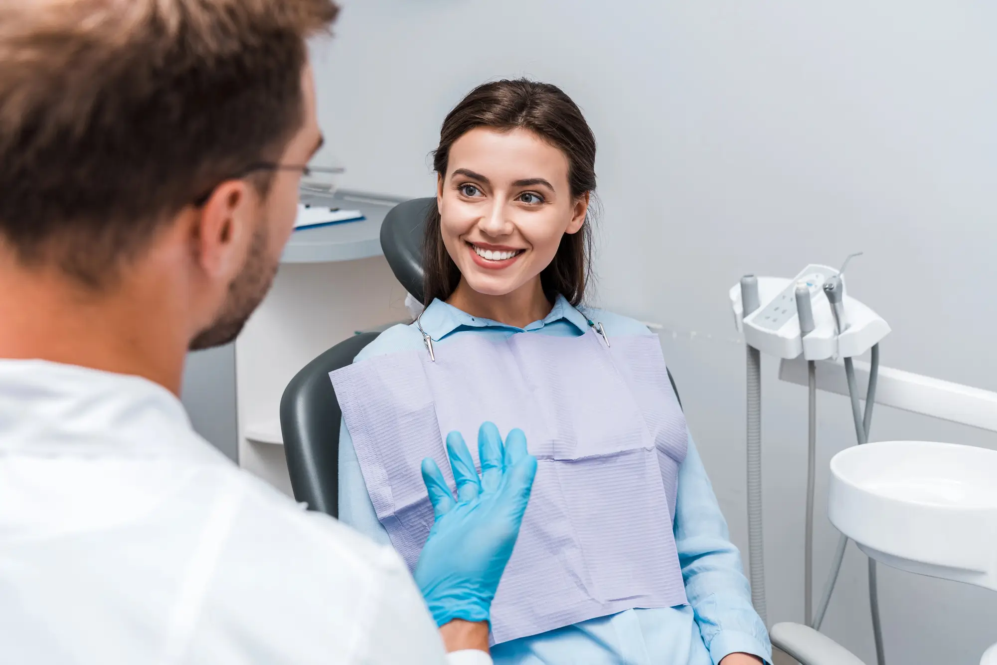 Patient Consulting A Dentist About Dental Cleanings Canton Michigan